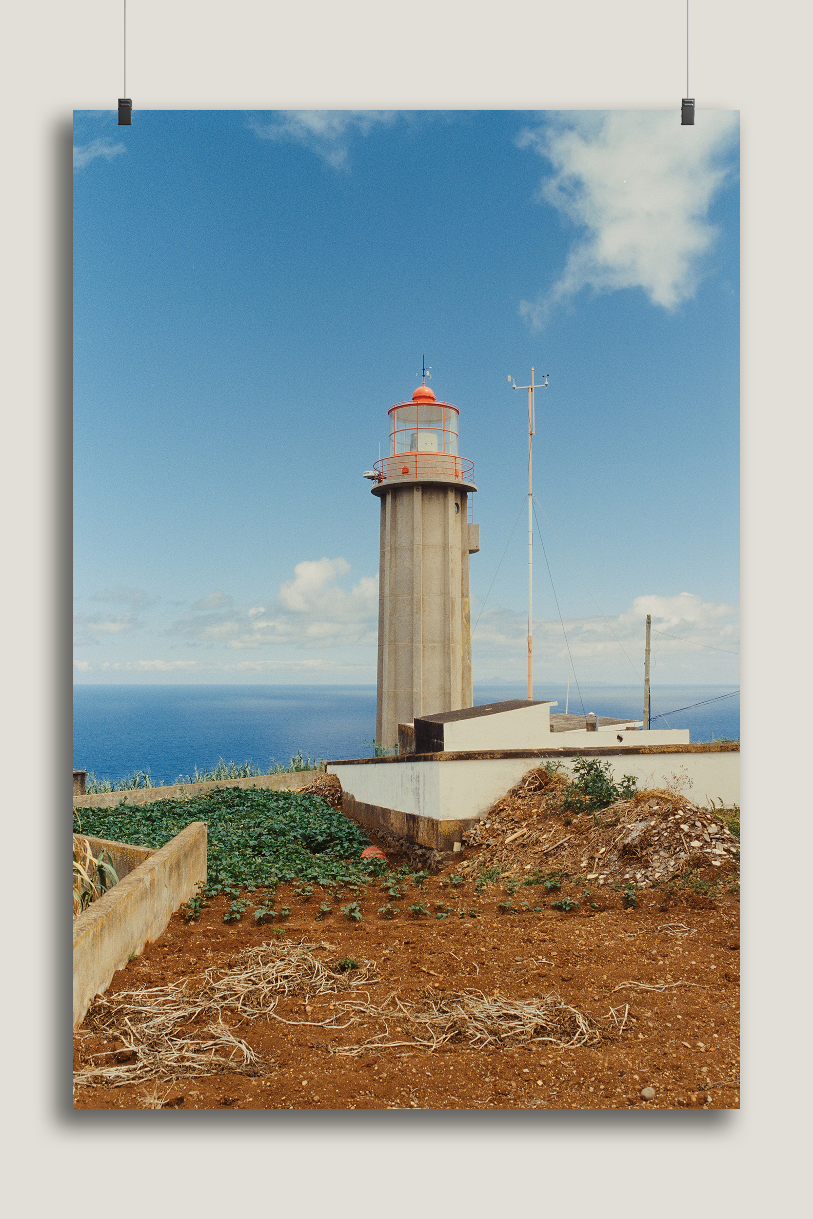 fine art print of a lighthouse in the style of wes anderson photographed on madeira island