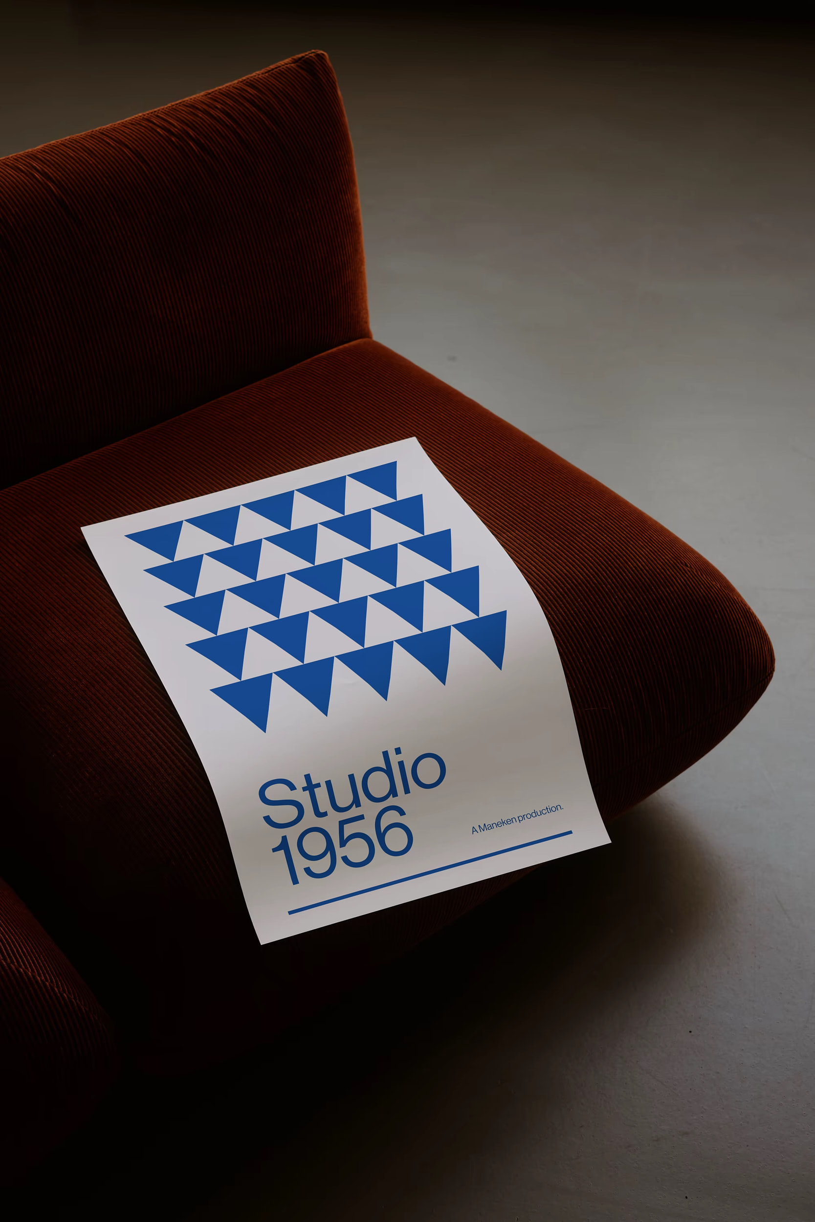 Poster displayed in atmospheric still life setting, shot by David Altrath.