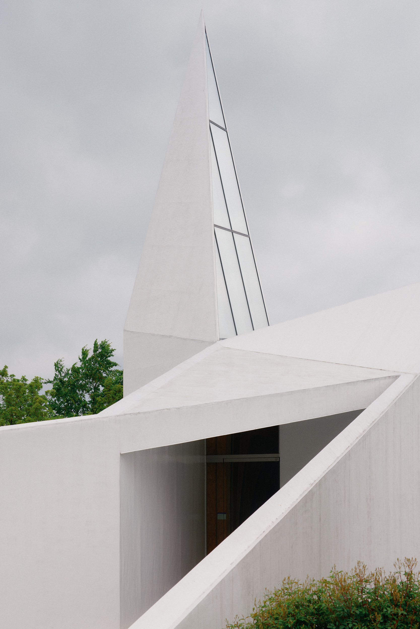 Minimal white church architecture of Autobahnkirche Siegerland photographed near the A45 in Wilnsdorf.