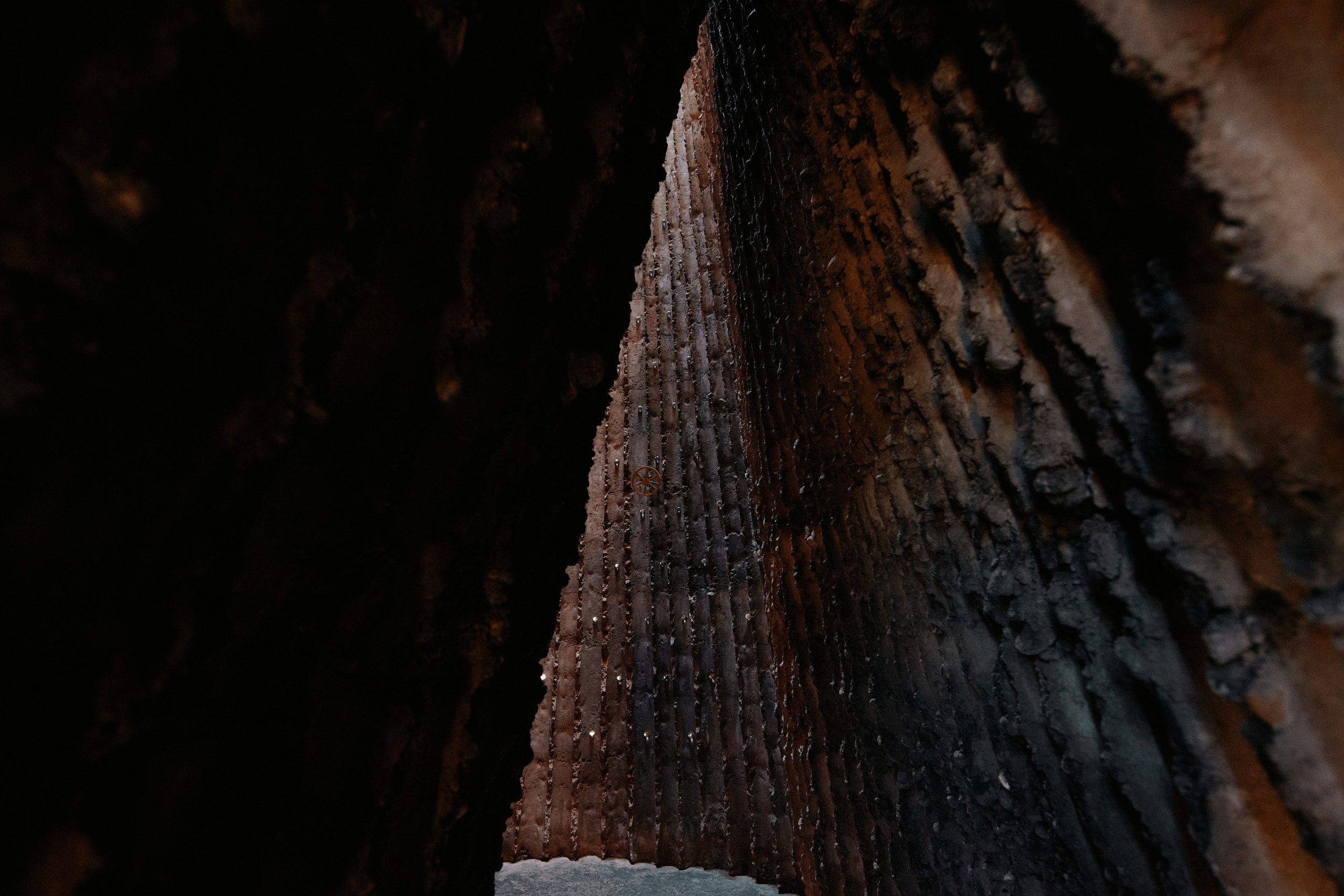 Raw rammed concrete walls of Peter Zumthor’s Bruder Klaus Chapel